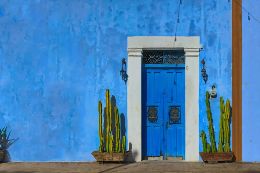Avila Travel Mexico colourful facade with door